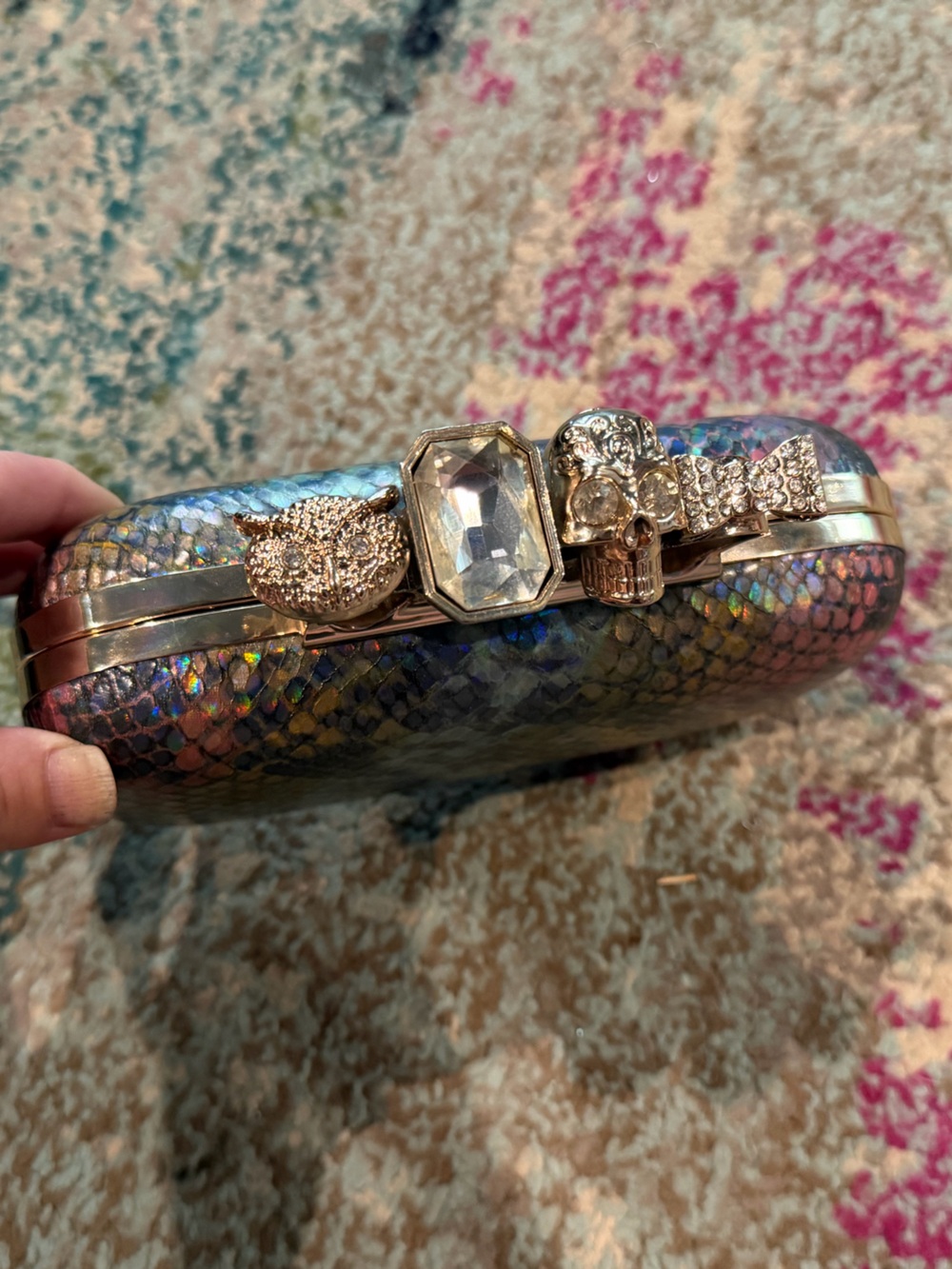 Irridescent Snake Print Clutch with Skull Knuckles